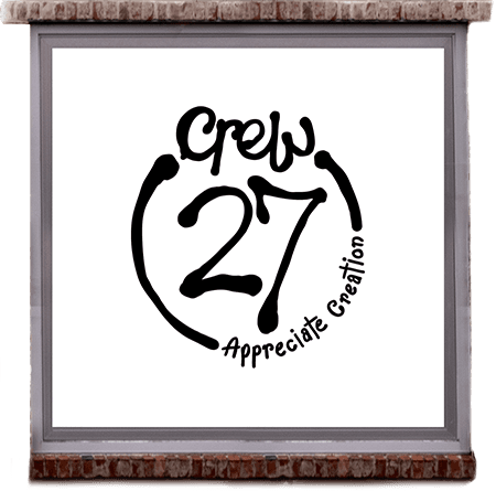 CREW 27 artwork in a brick-framed window